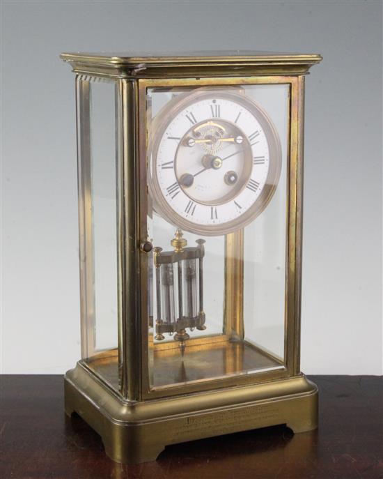 A Victorian brass four glass mantel clock, 12in.